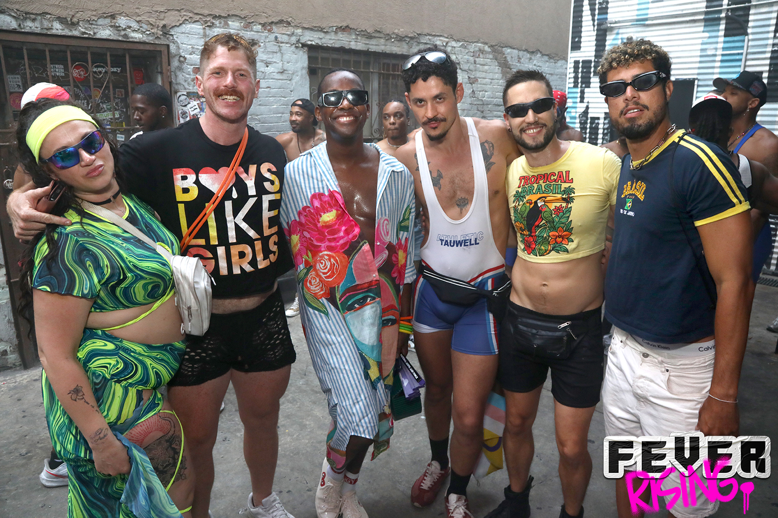 Group of friends in bright festival outfits outside the venue